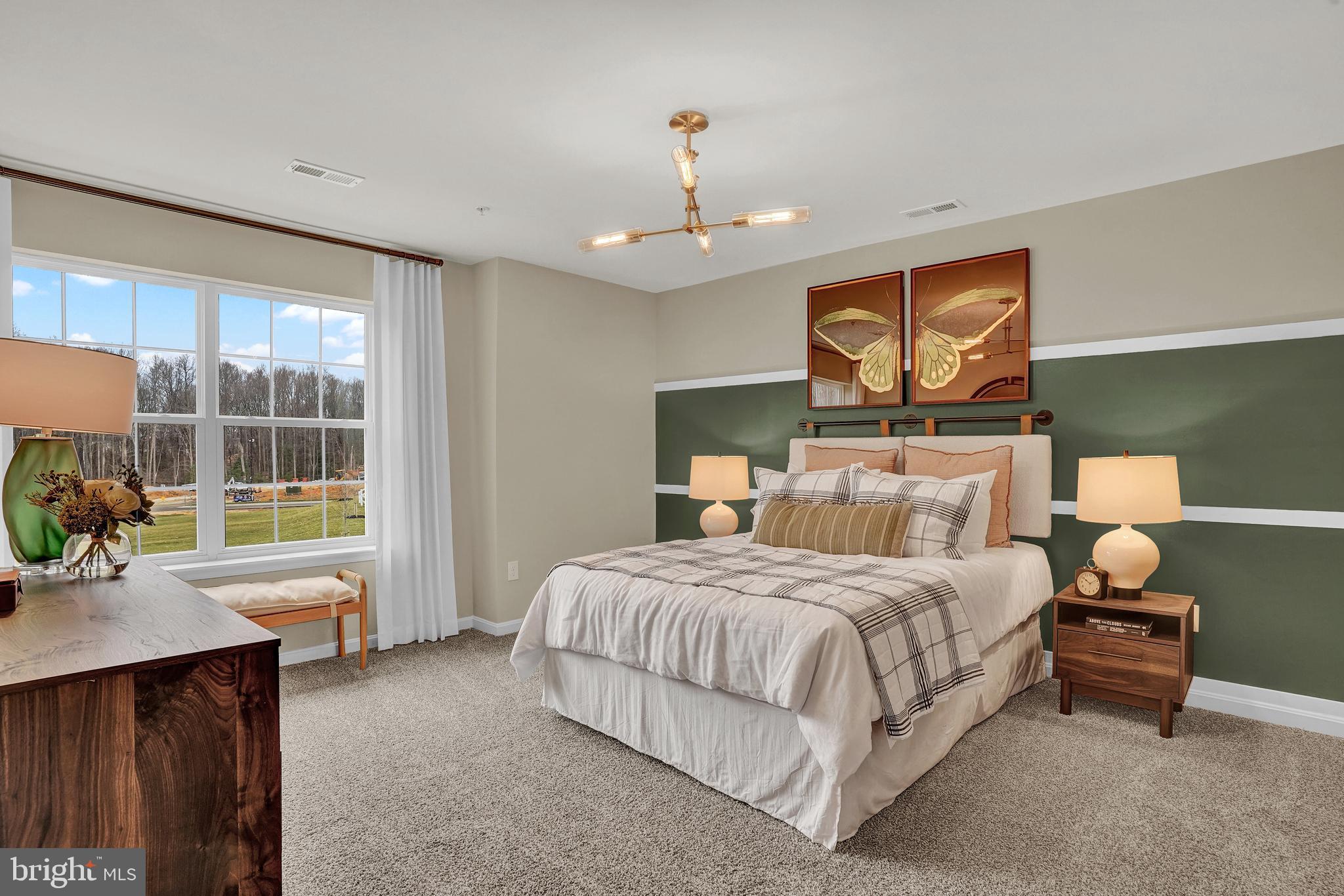 246 Eclipse Street Ranson, WV 25438 - Photo 22 of 35 a bedroom with a bed and a chandelier