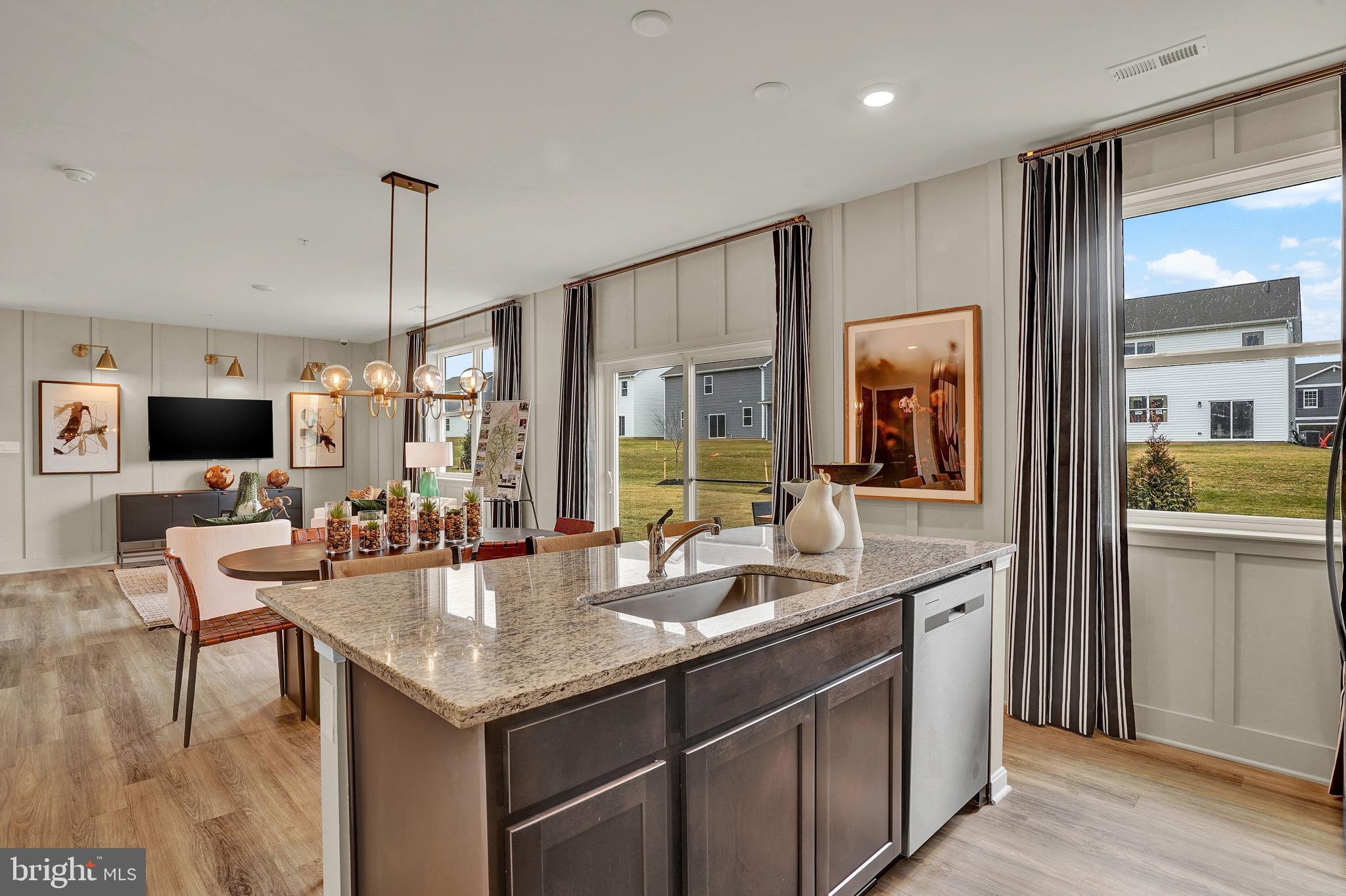 246 Eclipse Street Ranson, WV 25438 - Photo 7 of 35 a open kitchen with stainless steel appliances granite countertop a sink and refrigerator
