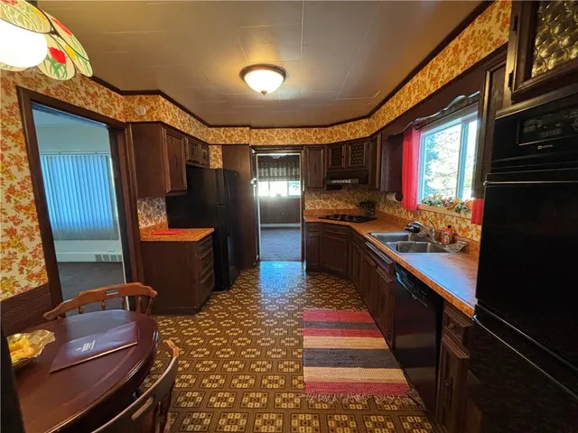 a lobby with furniture and rug