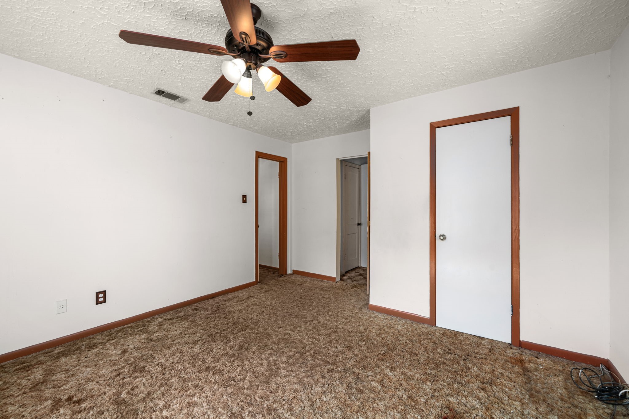 56 Wellford Street Houston, TX 77022 - Photo 14 of 26 a view of a big room with closet and ceiling fan