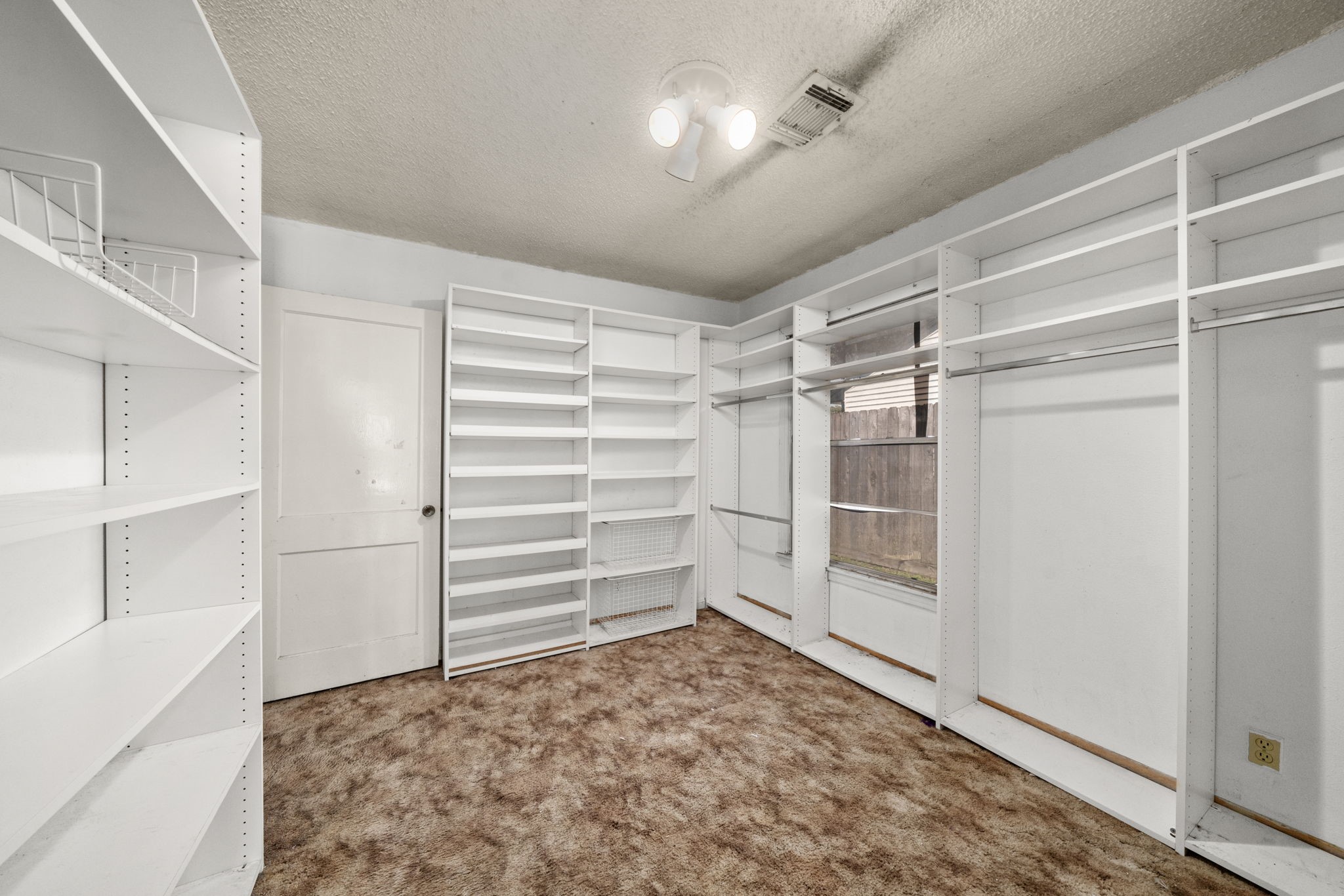56 Wellford Street Houston, TX 77022 - Photo 15 of 26 a view of an empty walk in closet