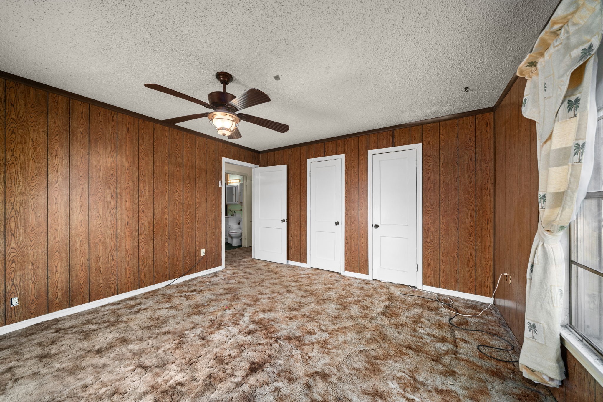 56 Wellford Street Houston, TX 77022 - Photo 18 of 26 a view of a livingroom with a chandelier fan and wooden floor