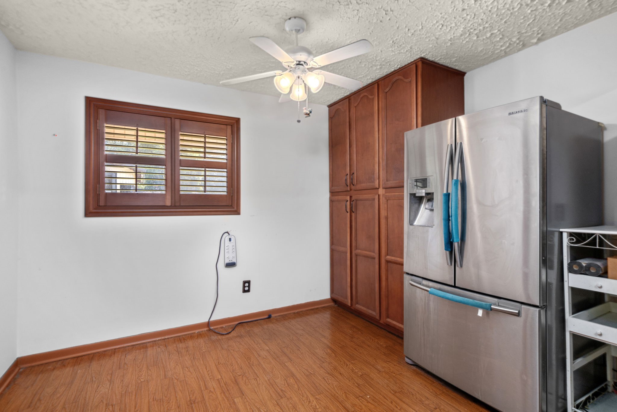 56 Wellford Street Houston, TX 77022 - Photo 9 of 26 a kitchen with stainless steel appliances a refrigerator sink and cabinets