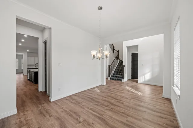 a view interior of a house with wooden floor and a chandelier