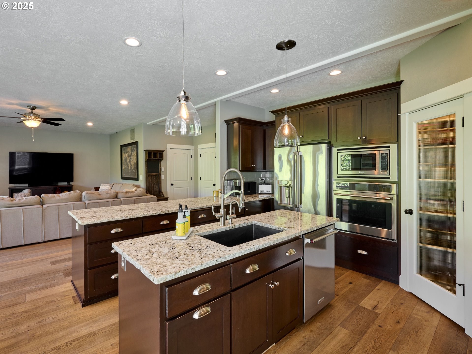 3035 Elliot Street Northwest Salem, OR 97304 - Photo 14 of 46 a kitchen with a stove a refrigerator and a microwave