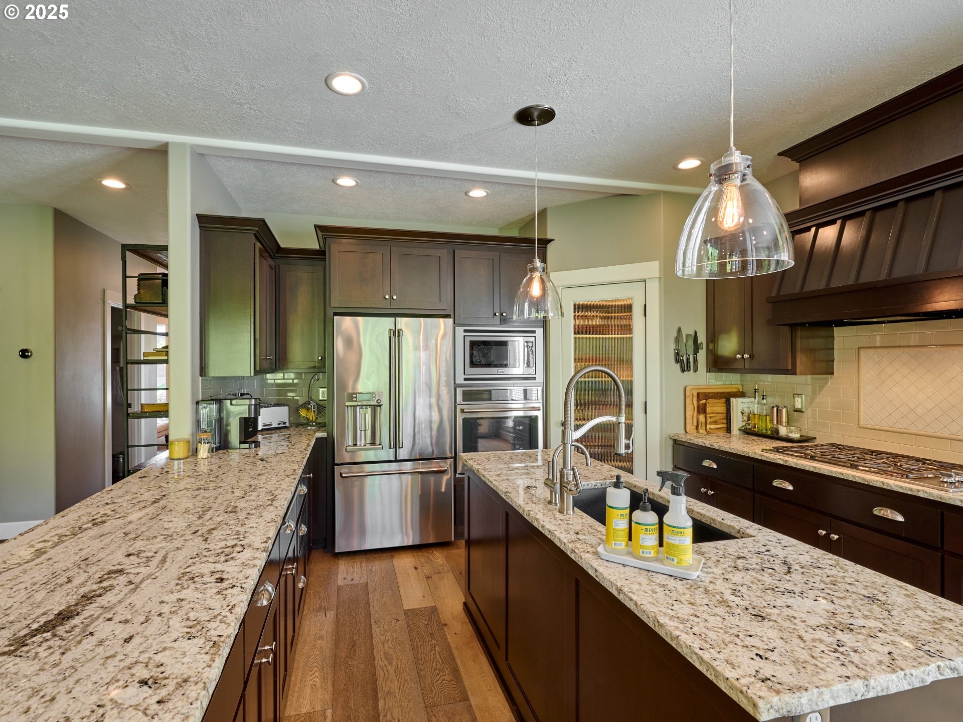 3035 Elliot Street Northwest Salem, OR 97304 - Photo 15 of 46 a kitchen with stainless steel appliances granite countertop a sink stove and refrigerator
