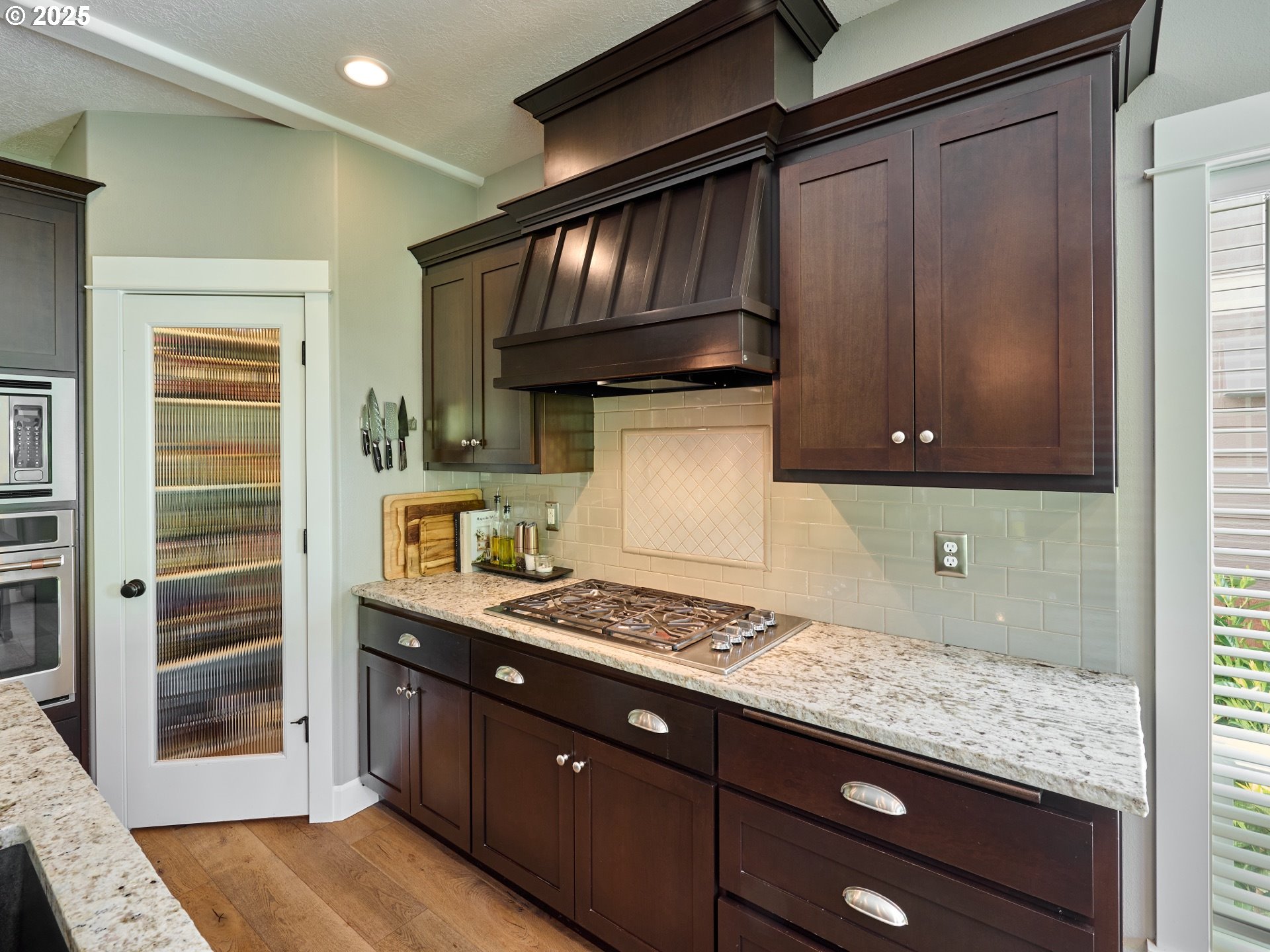 3035 Elliot Street Northwest Salem, OR 97304 - Photo 16 of 46 a kitchen with stainless steel appliances granite countertop a stove and a refrigerator