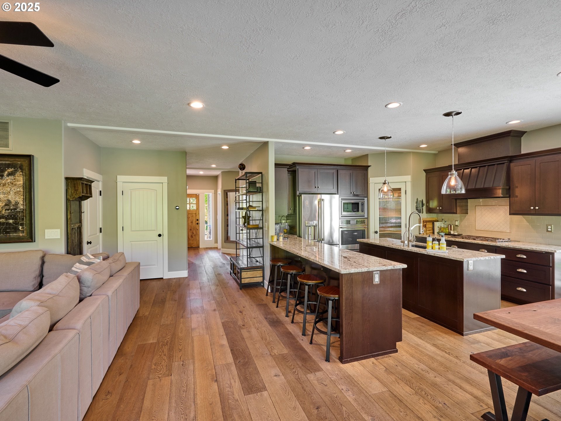 3035 Elliot Street Northwest Salem, OR 97304 - Photo 17 of 46 a large kitchen with stainless steel appliances lots of counter space and breakfast area