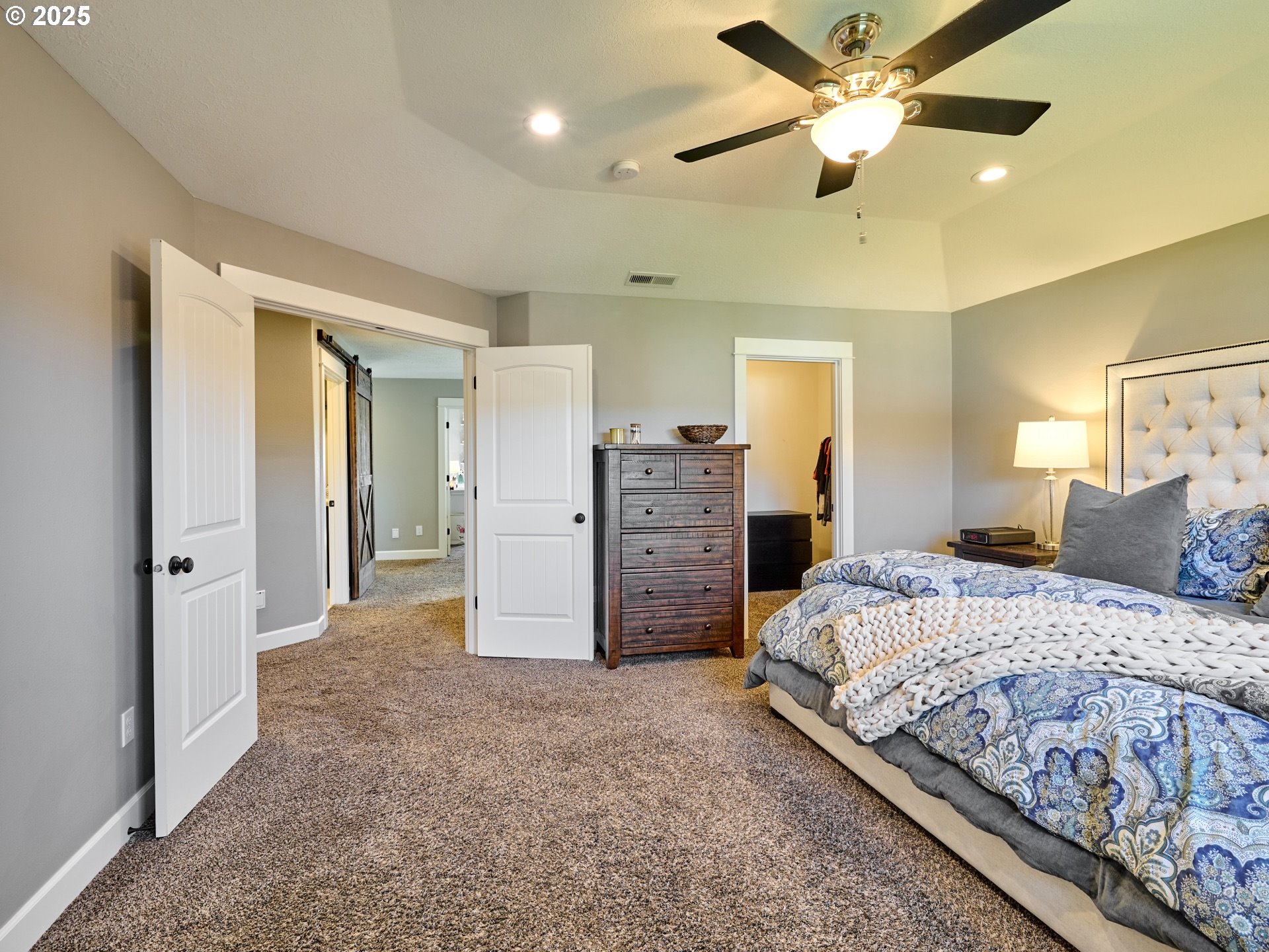 3035 Elliot Street Northwest Salem, OR 97304 - Photo 21 of 46 a spacious bedroom with a bed and a chandelier