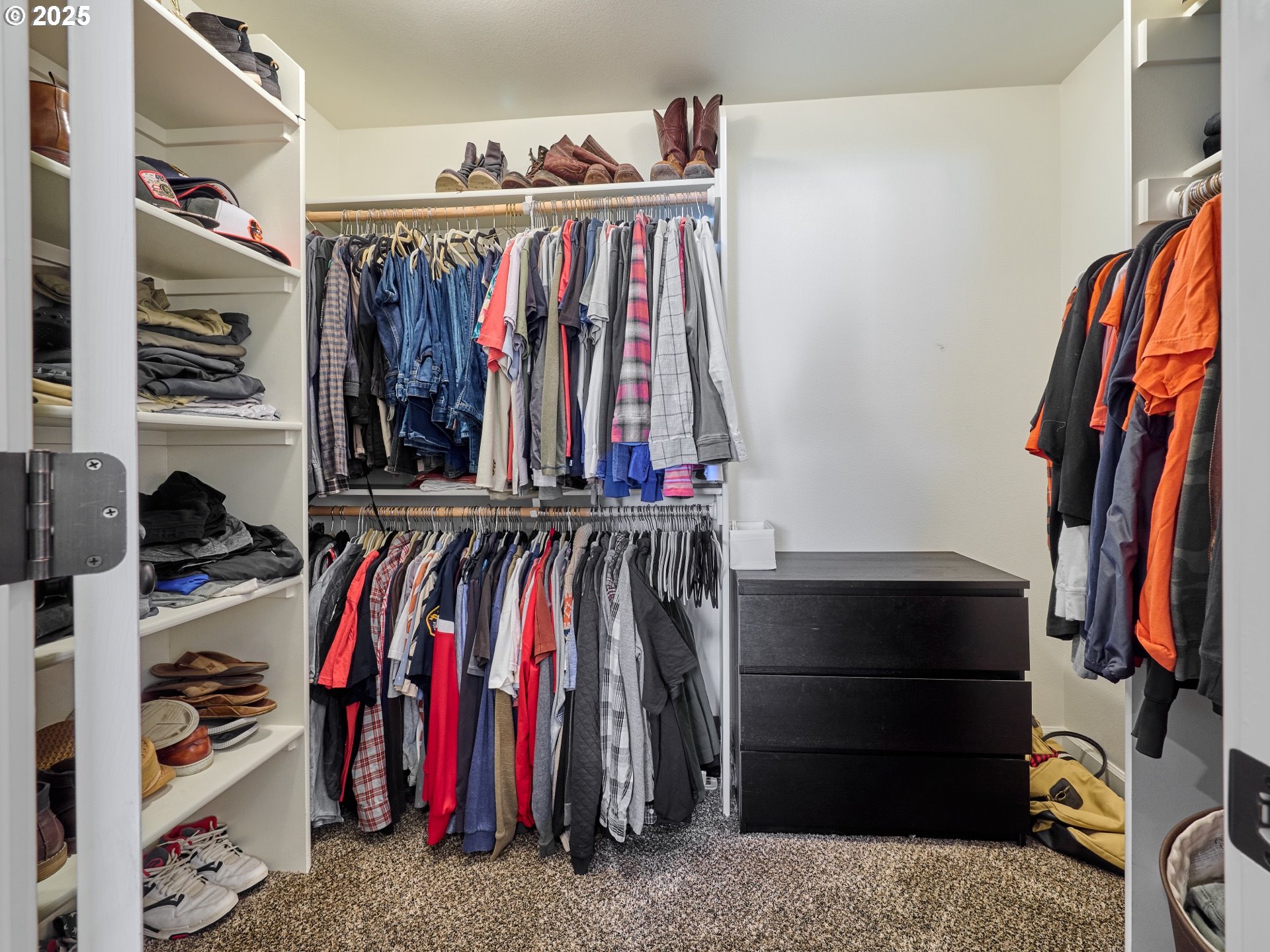 3035 Elliot Street Northwest Salem, OR 97304 - Photo 22 of 46 a view of walk in closet with clothes and shoes