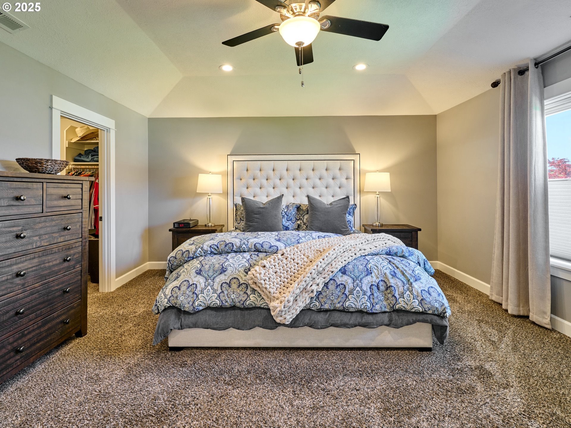 3035 Elliot Street Northwest Salem, OR 97304 - Photo 23 of 46 a bedroom with a large bed and a chandelier