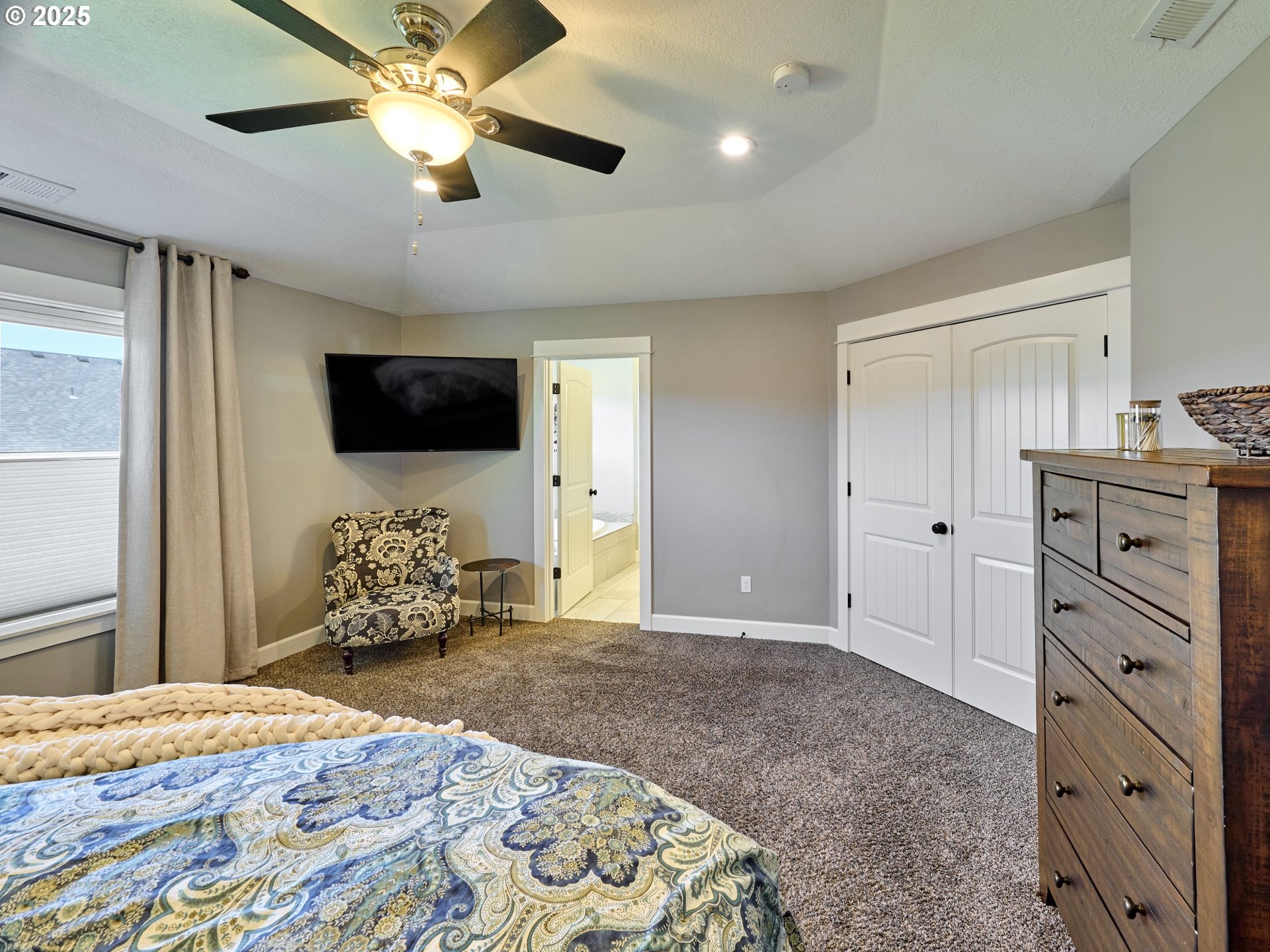 3035 Elliot Street Northwest Salem, OR 97304 - Photo 25 of 46 a bedroom with a bed and a flat screen tv