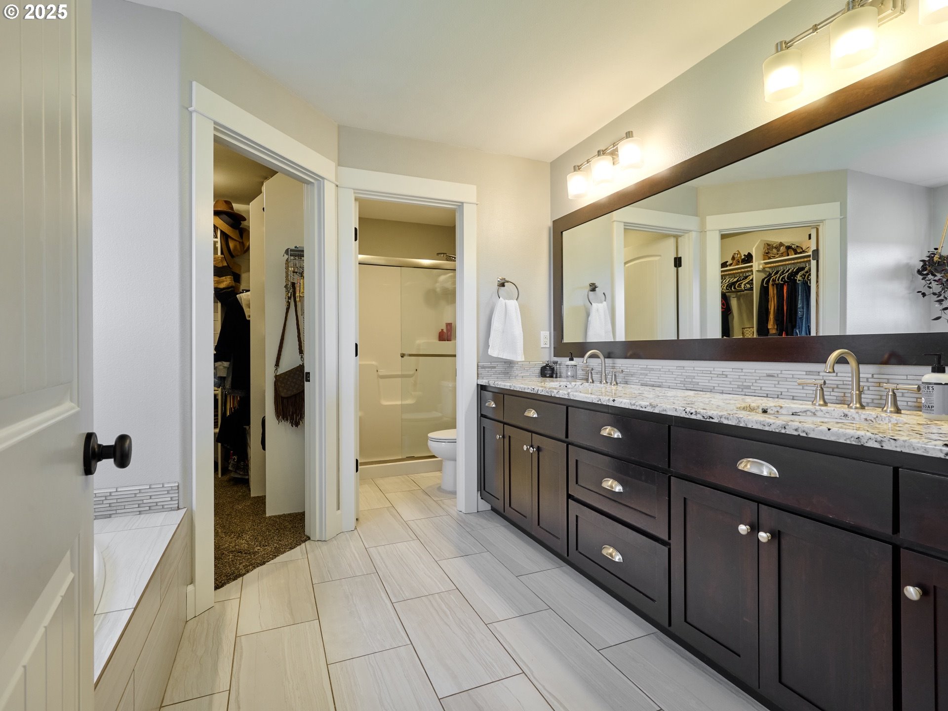 3035 Elliot Street Northwest Salem, OR 97304 - Photo 28 of 46 a spacious bathroom with a granite countertop sink mirror and shower