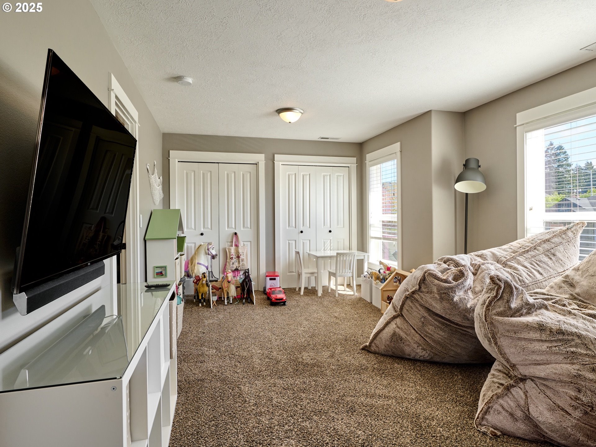 3035 Elliot Street Northwest Salem, OR 97304 - Photo 33 of 46 a bedroom with furniture and a flat screen tv