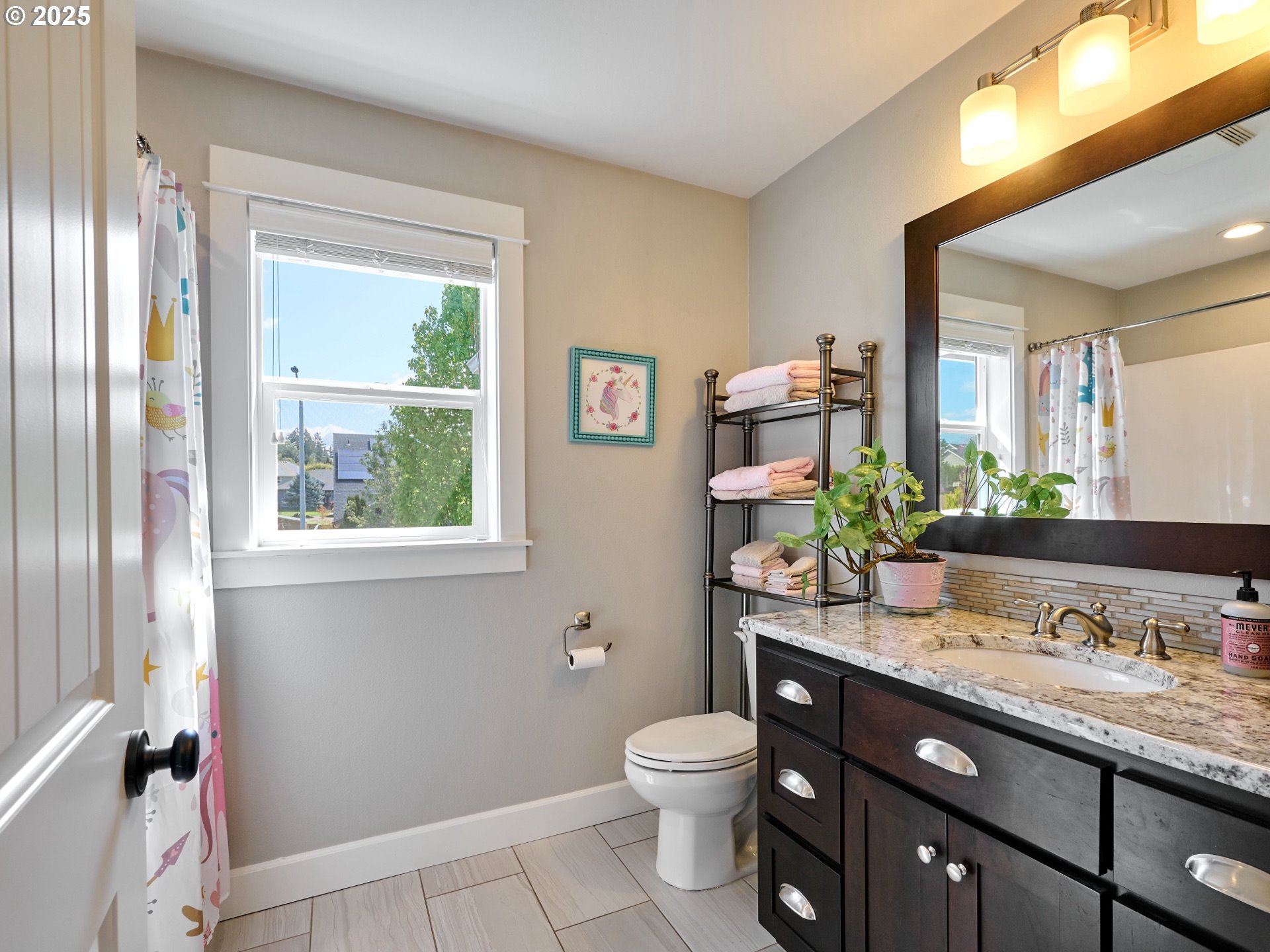 3035 Elliot Street Northwest Salem, OR 97304 - Photo 38 of 46 a bathroom with a granite countertop toilet sink and mirror