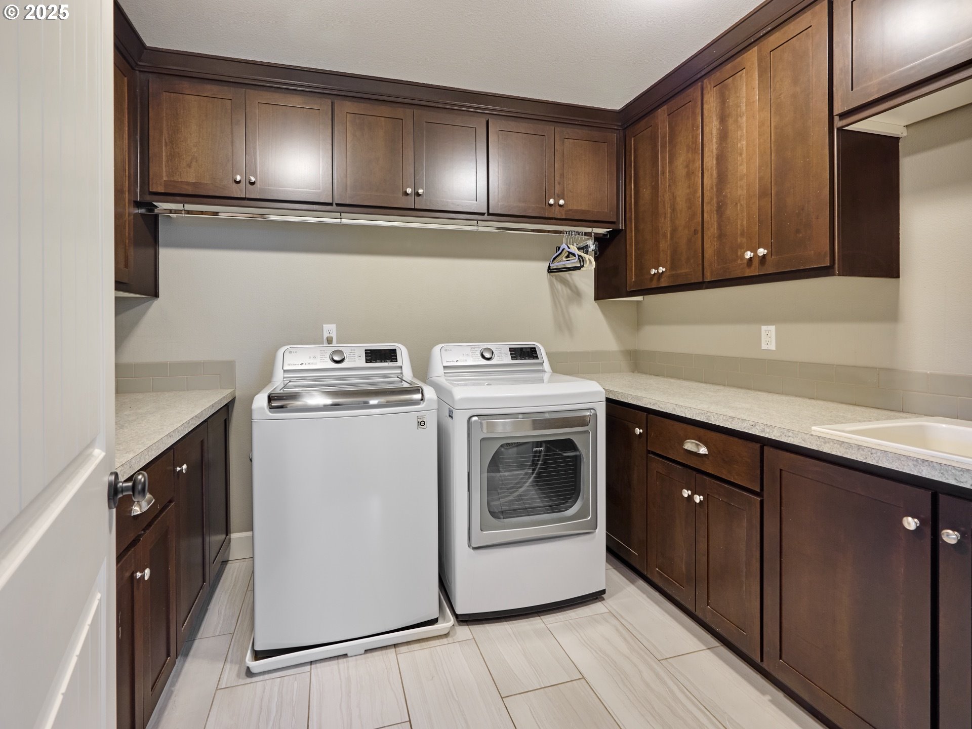3035 Elliot Street Northwest Salem, OR 97304 - Photo 39 of 46 a utility room with sink dryer and washer