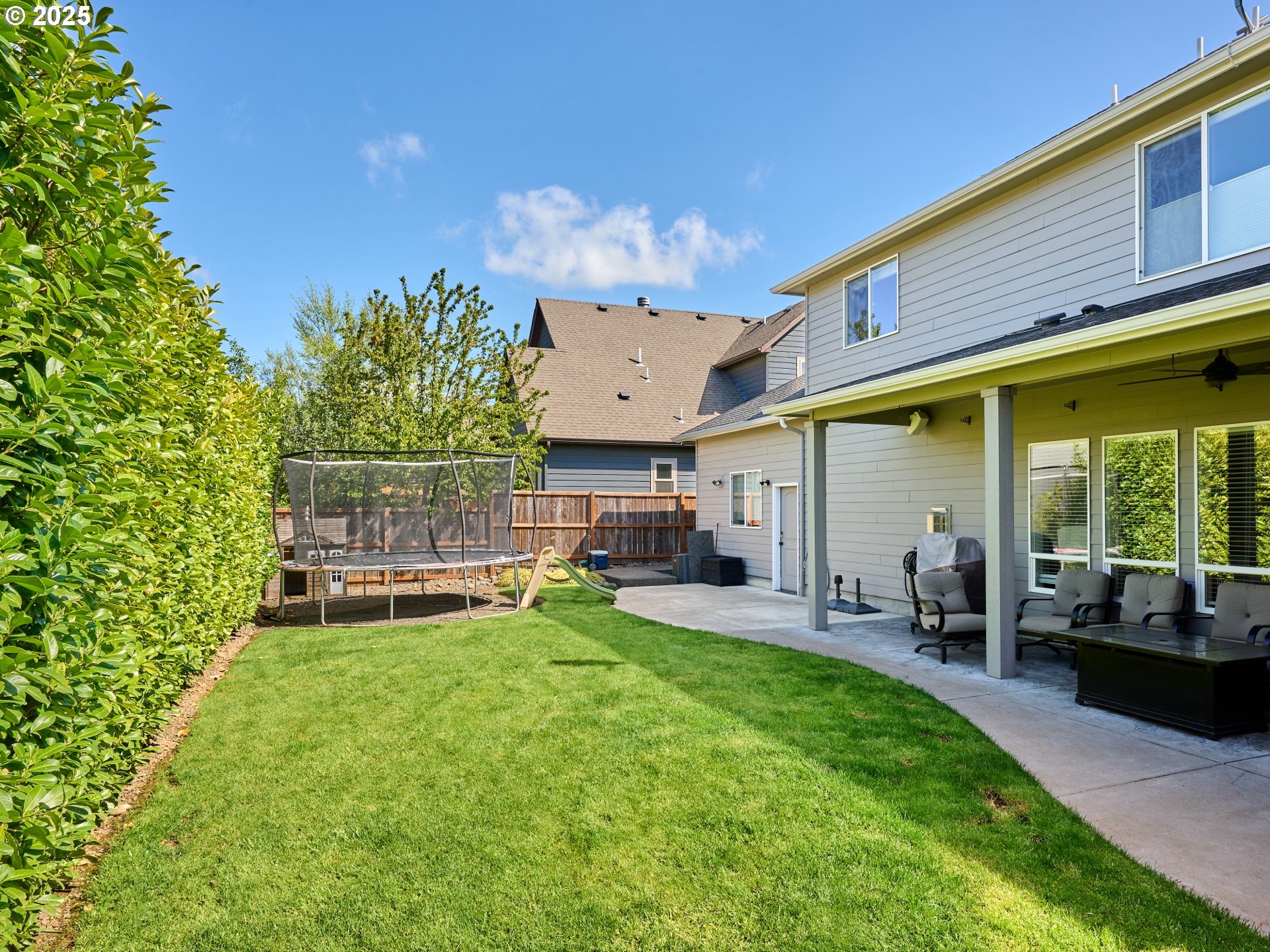 3035 Elliot Street Northwest Salem, OR 97304 - Photo 46 of 46 a view of a backyard with table and chairs and a barbeque