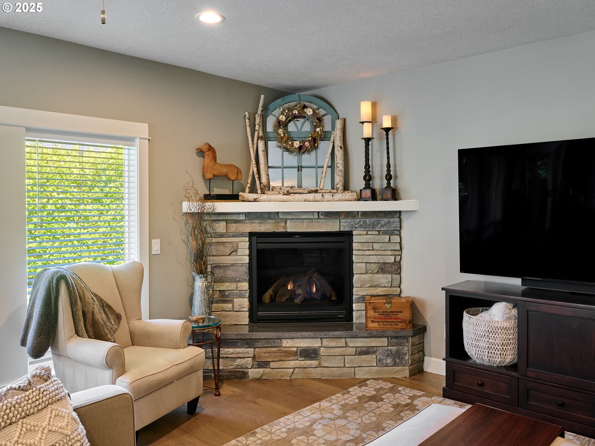 3035 Elliot Street Northwest Salem, OR 97304 - Photo 8 of 46 a living room with furniture a flat screen tv and a fireplace