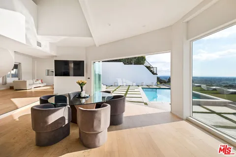 a view of a living room and dining room