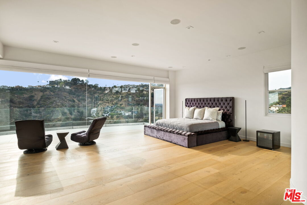 7868 Electra Drive Los Angeles, CA 90046 - Photo 19 of 42 a living room with furniture and a large window