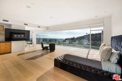 a living room with furniture fireplace and flat screen tv