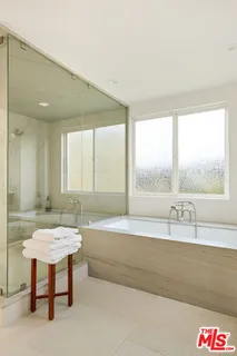 a bathroom with a bathtub and a sink