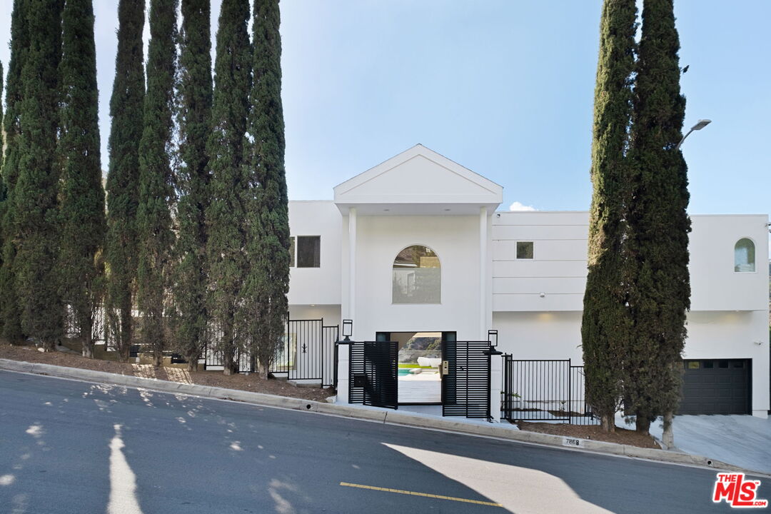 7868 Electra Drive Los Angeles, CA 90046 - Photo 38 of 42 a front view of a house with street