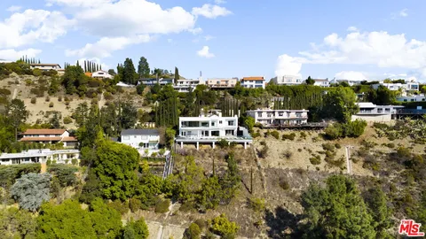 a picture of houses with city view
