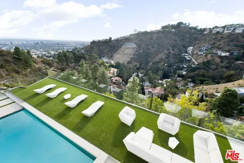 a view of swimming pool from a balcony