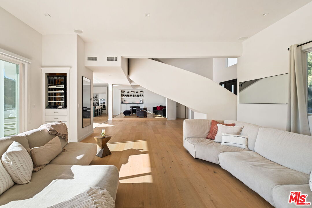 7868 Electra Drive Los Angeles, CA 90046 - Photo 6 of 42 a living room with furniture and view of kitchen