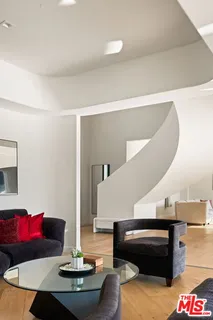 a living room with furniture and a table