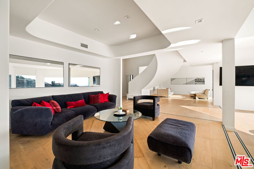 7868 Electra Drive Los Angeles, CA 90046 - Photo 8 of 42 a living room with furniture and a large window