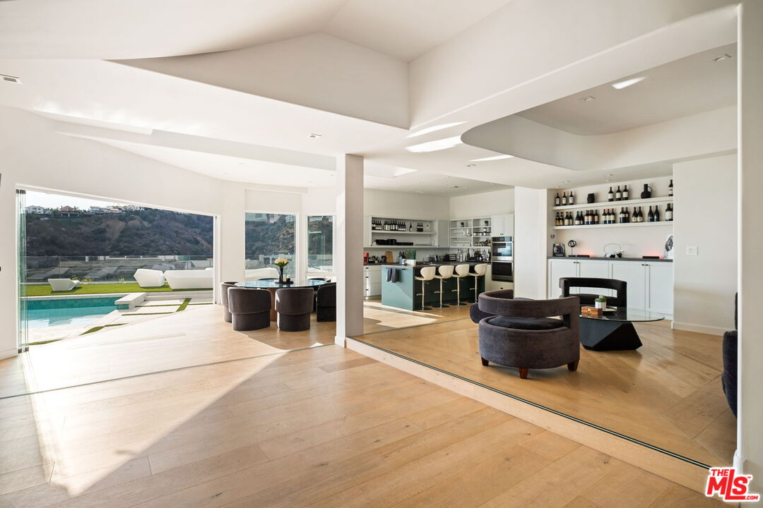 7868 Electra Drive Los Angeles, CA 90046 - Photo 9 of 42 a living room filled with furniture and a floor to ceiling window