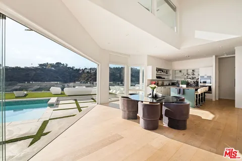 a living room with lots of furniture and a view of living room