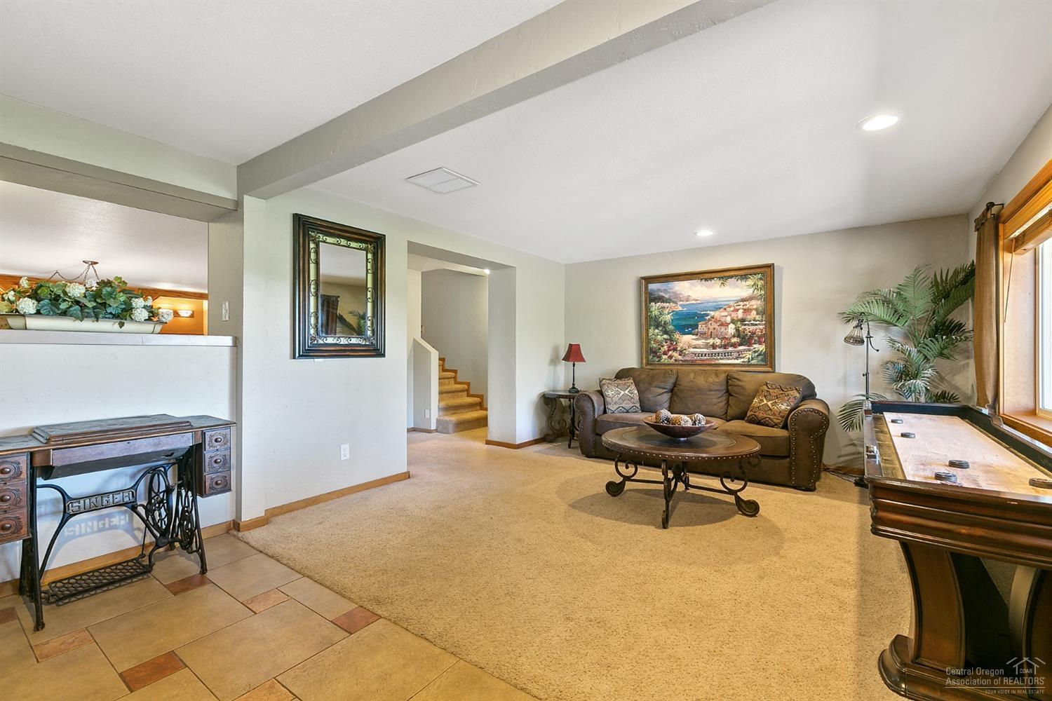 21210 Yeoman Road Bend, OR 97701 - Photo 18 of 25 a living room with furniture and a flat screen tv