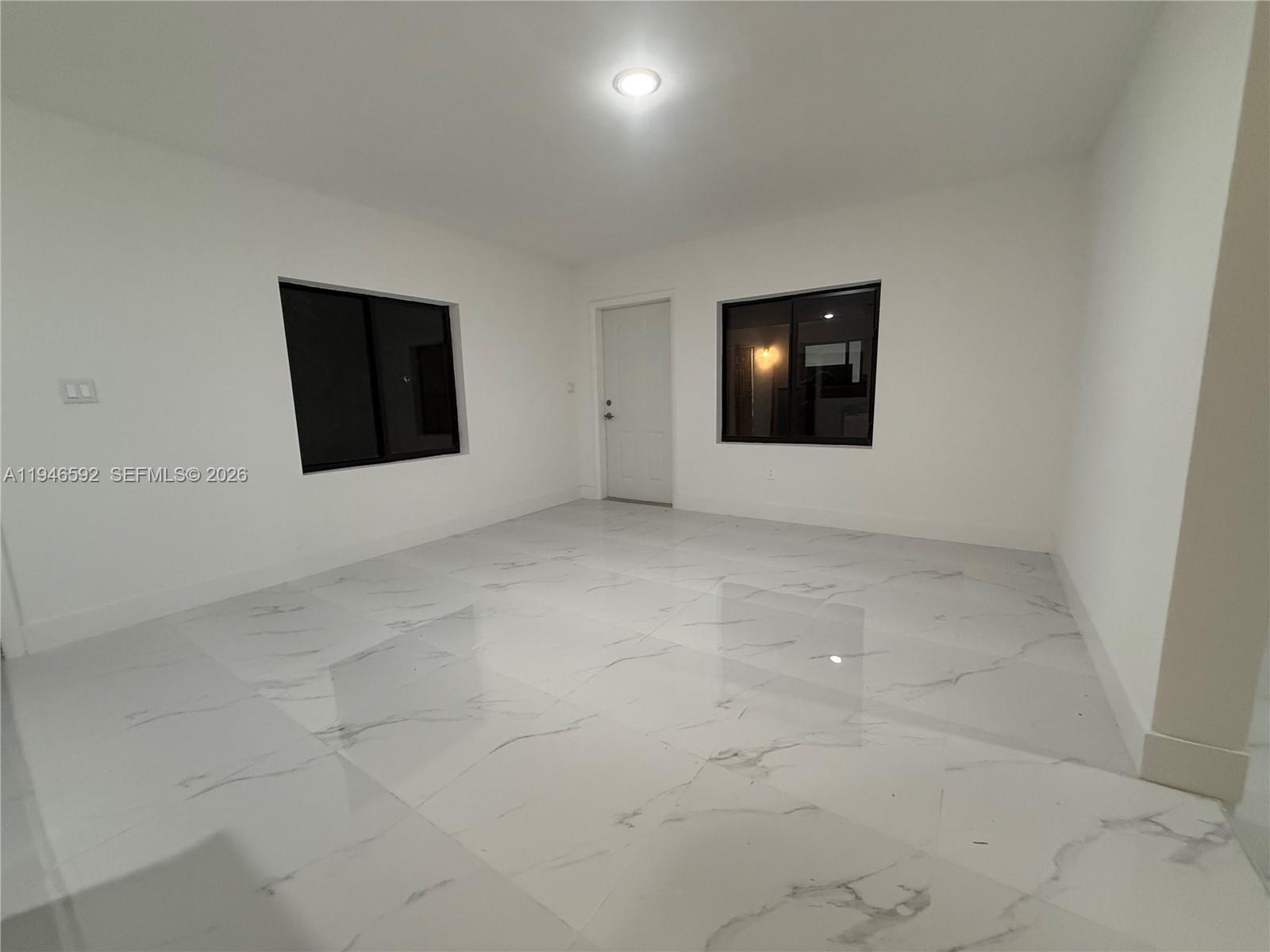 450 Beacom Boulevard, Unit C Miami, FL 33135 - Photo 8 of 9 a view of an empty room