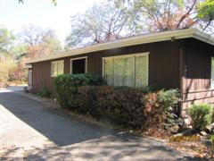 2663 Irwin Road Redding, CA 96002 - Photo 1 of 8 a view of a house with a yard