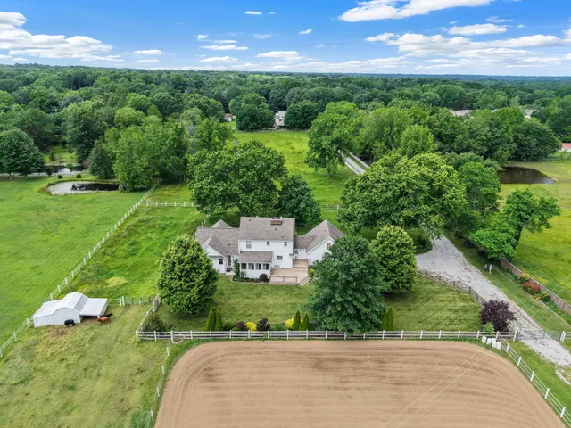 a view of a garden with a building in the background