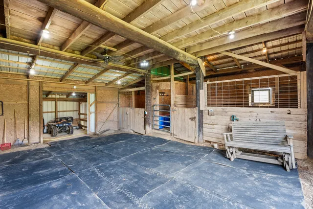 a view of empty room with wooden ceiling