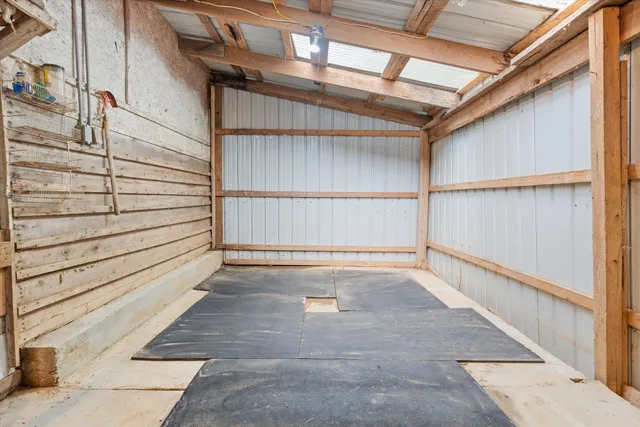 a view of an empty room with wooden walls