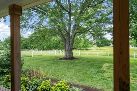 a view of an entryway with wooden floor and windows