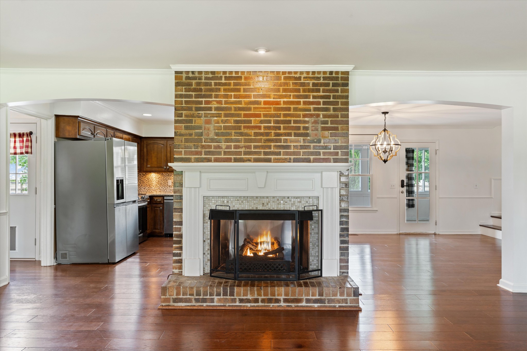 1967 Liebengood Road Goodlettsville, TN 37072 - Photo 32 of 57 a living room with a fireplace and wooden floor