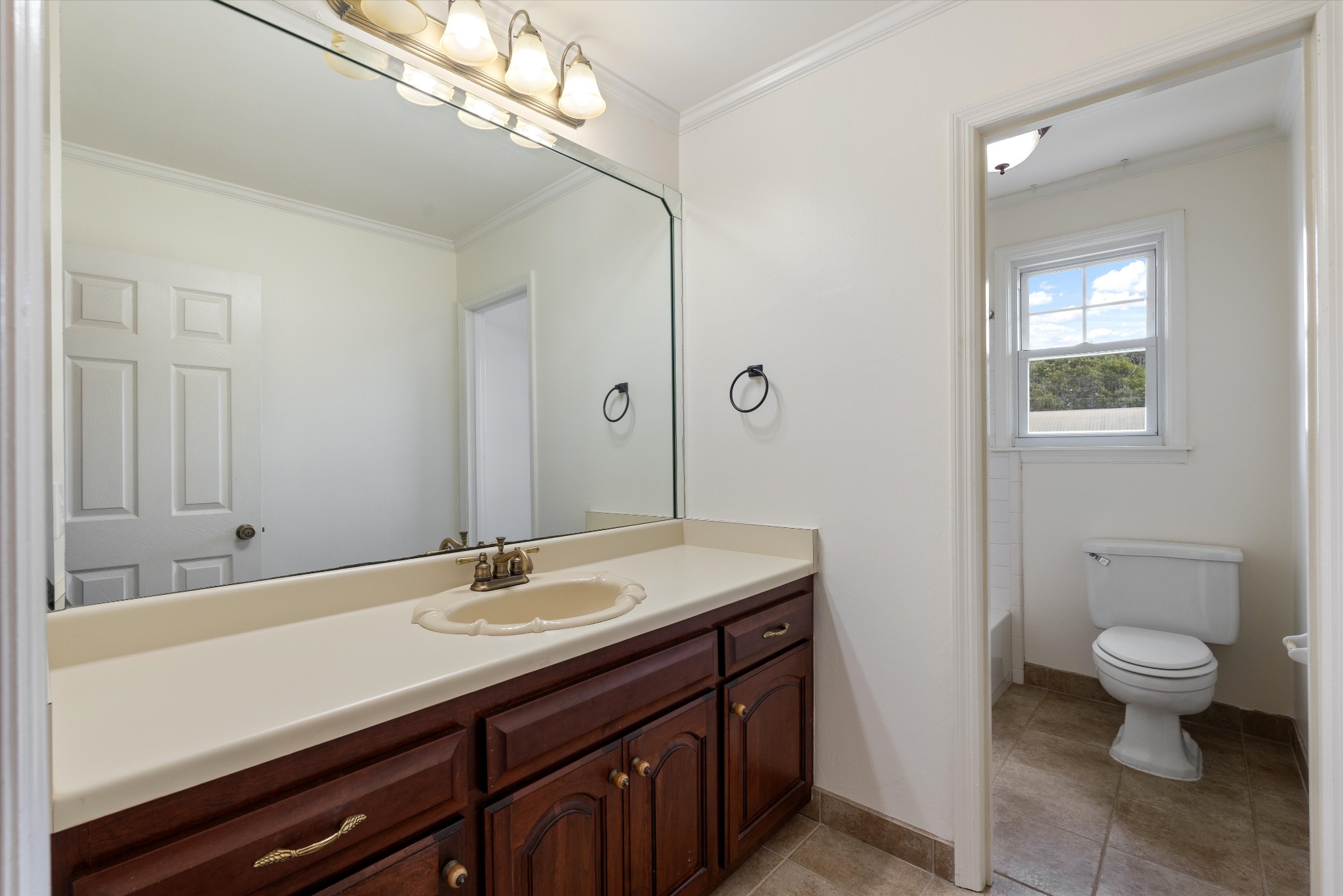 1967 Liebengood Road Goodlettsville, TN 37072 - Photo 50 of 57 a bathroom with a sink a toilet and a mirror