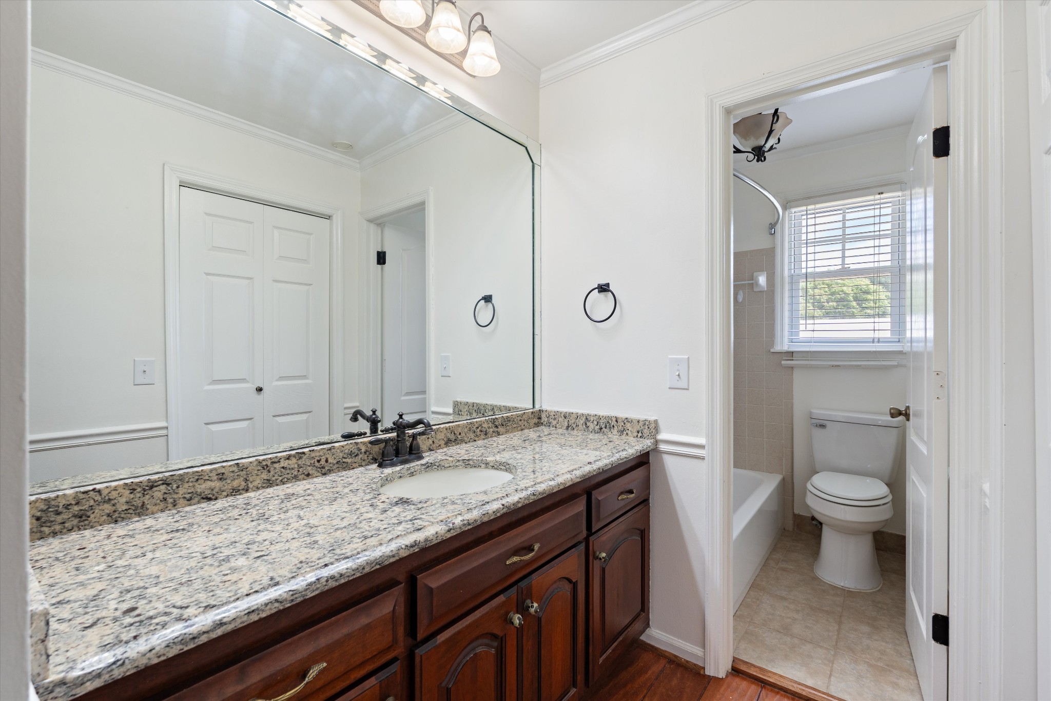 1967 Liebengood Road Goodlettsville, TN 37072 - Photo 54 of 57 a bathroom with a granite countertop sink a toilet and a mirror