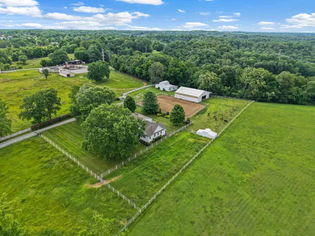 a view of a garden with a building in the background