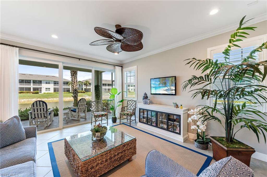 6948 Avalon Circle, Unit 604 Naples, FL 34112 - Photo 1 of 33 Living room featuring ornamental molding, ceiling fan, recessed lighting, and a healthy amount of sunlight
