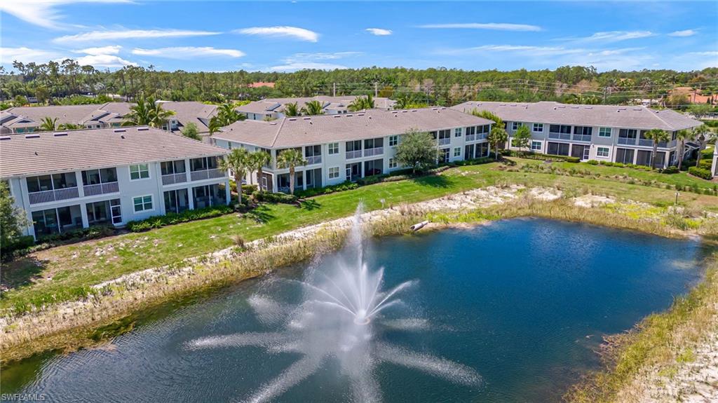 6948 Avalon Circle, Unit 604 Naples, FL 34112 - Photo 28 of 33 Aerial view featuring a residential view and a water view