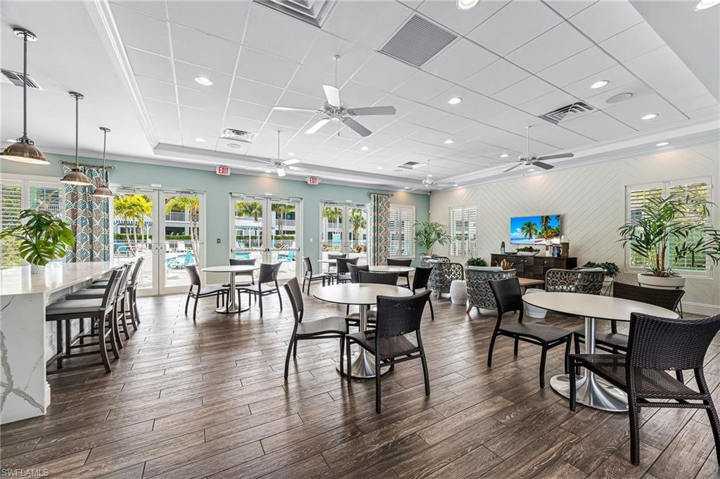 6948 Avalon Circle, Unit 604 Naples, FL 34112 - Photo 32 of 33 Dining area with a paneled ceiling, french doors, ceiling fan, and visible vents