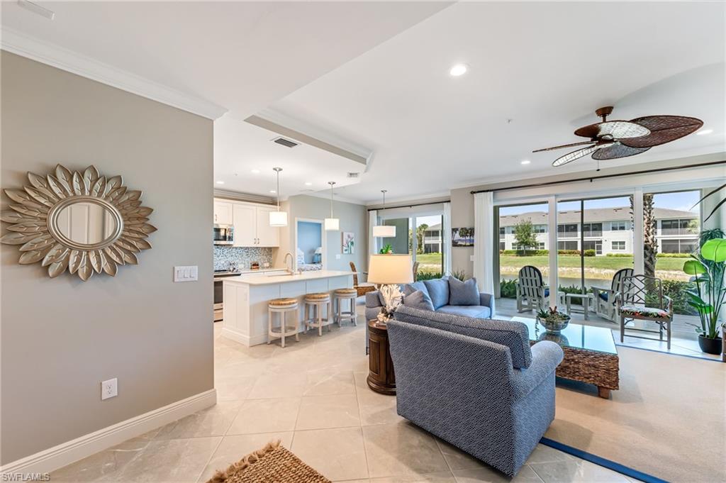 6948 Avalon Circle, Unit 604 Naples, FL 34112 - Photo 4 of 33 Living room featuring ceiling fan, ornamental molding, and recessed lighting