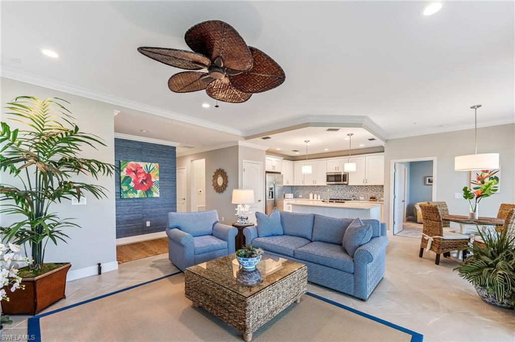 6948 Avalon Circle, Unit 604 Naples, FL 34112 - Photo 5 of 33 Living area featuring crown molding, baseboards, recessed lighting, and a ceiling fan